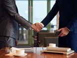 mid-section-two-unrecognizable-businessmen-shaking-hands-finalize-deal.jpg